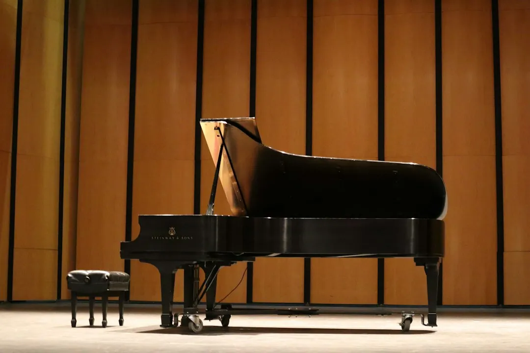 Grand piano on a concert hall stage
